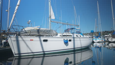 close up shot of the boat on a calm ocean water at cruise ship terminals at seattle, wa usa on a sunny day with many boats behind