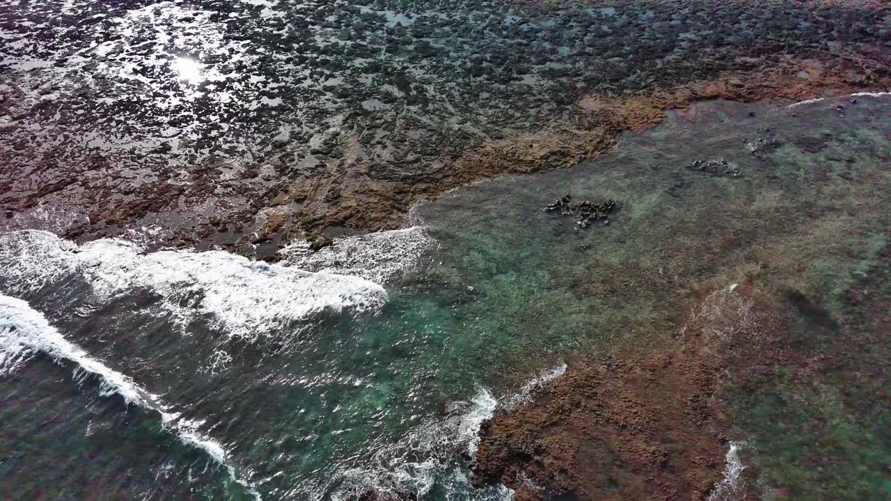 Corralejo's rocky coastline with clear turquoise waters, fuerteventura, aerial view