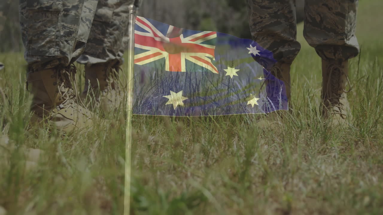 Military boots stepping on Australian flag in grassy field with animation effect
