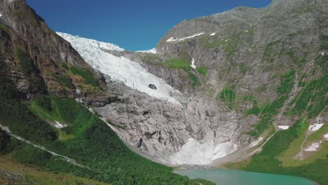 aerial shot of bøyabreen glacier in norway on a summer day pt