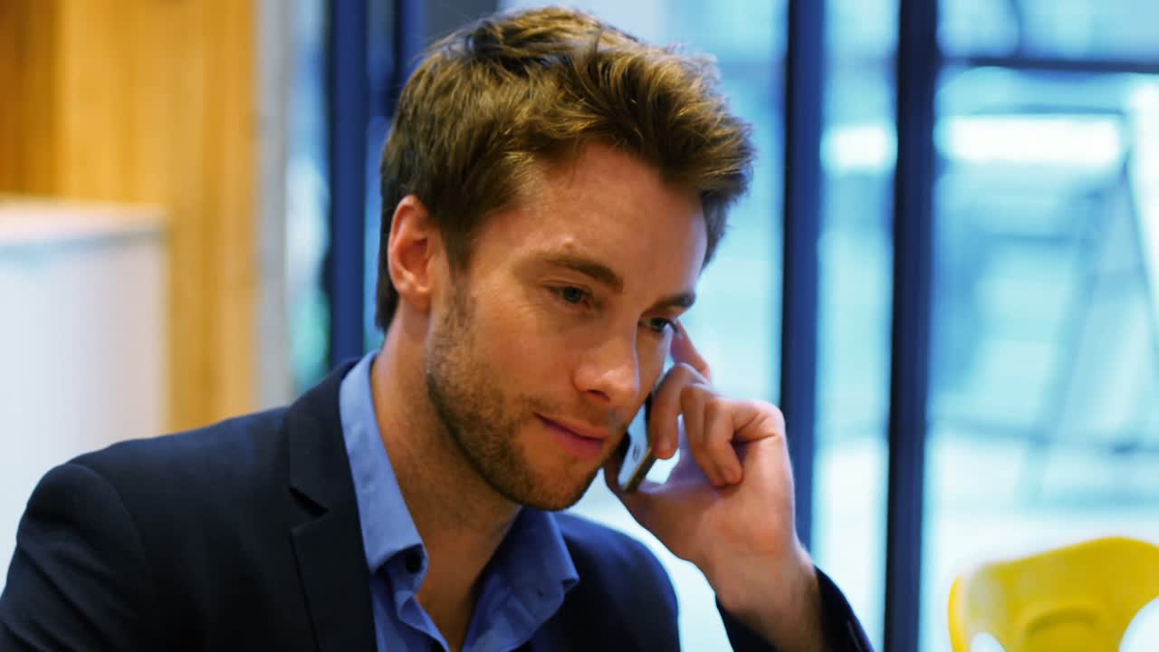 Businessman talking on mobile phone