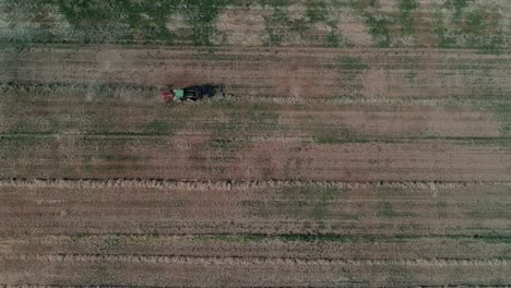 an overhead shot of a tractor plowing the ground