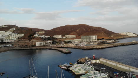 sailboats and yachts moored at the port of las palmas in gran canaria, canary islands, spain - aerial drone