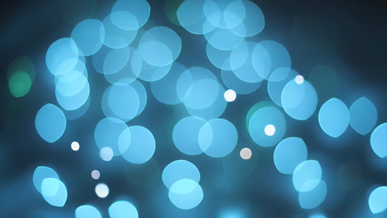 Abstract Background of Shifting Colorful Bokeh Light Orbs