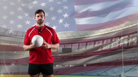 jugador de rugby profesional de pie frente a una bandera y un estadio