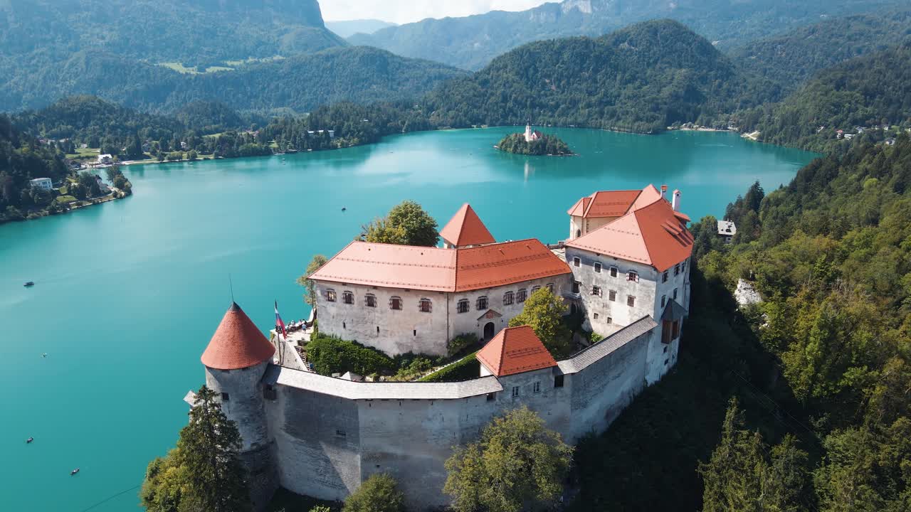 Aerial view capturing architecture of Lake Bled Castle in Slovenia during daytime.