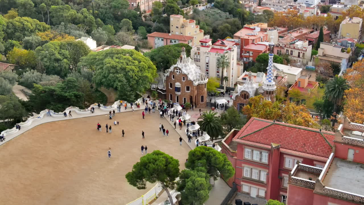 Aerial drone view of Barcelona, Spain. Park Guell with tourists, a lot of greenery