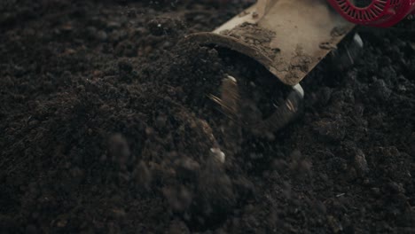 hand tractor tiller ploughing the soil in the field