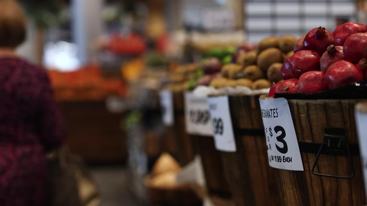 Shoppers browse vibrant fruit displays at a bustling Gold Coast market, captured with dynamic camera movement and natural lighting