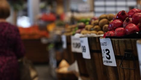shoppers browse vibrant fruit displays at a bustling gold coast market, captured with dynamic camera movement and natural lighting