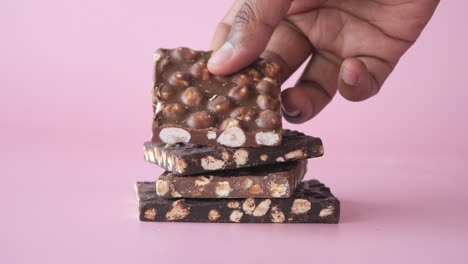 closeup of a stack of chocolate bars with nuts