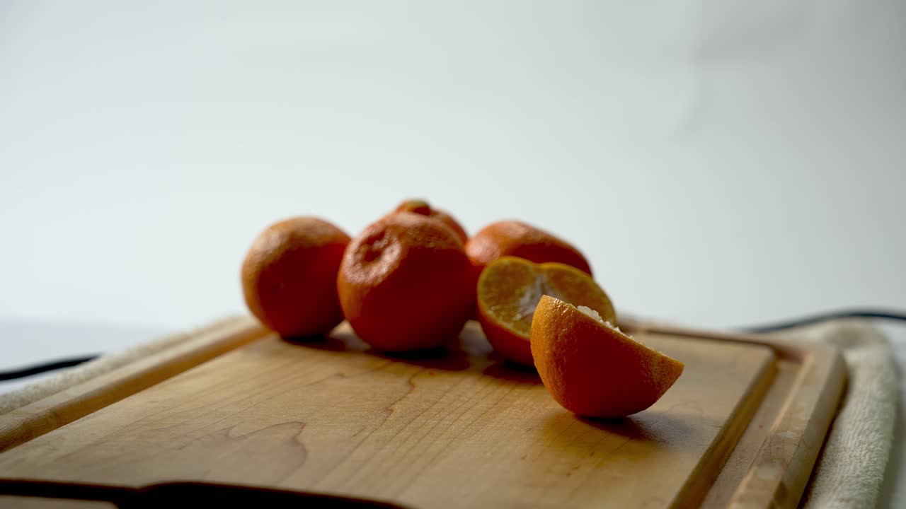 Kitchen utensil, hand cut foods, pure harvested organic oranges, close-up