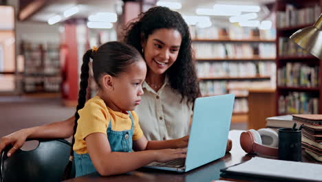 student and teacher using laptop in library