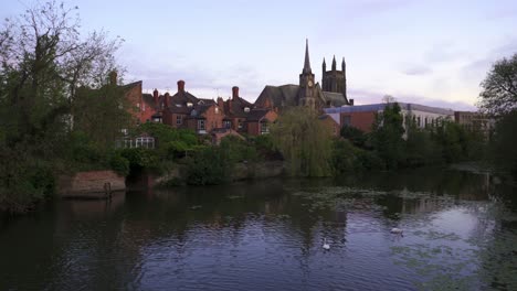 Royal-Leamington-Spa,-view-of-the-neogothic-church-across-the-river-Leam-on-a-tranquil-summer-evening