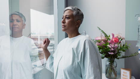 Sad,-woman-and-thinking-at-window-in-hospital