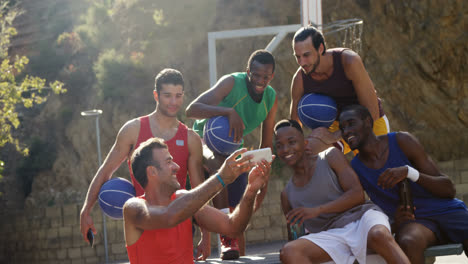 basketball players taking a selfie