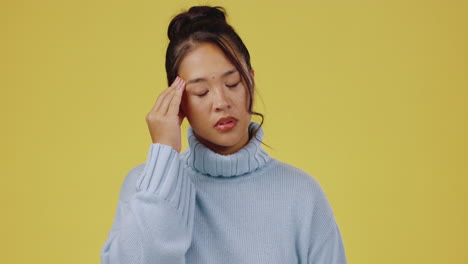 젊은 아시아 여성, 두통