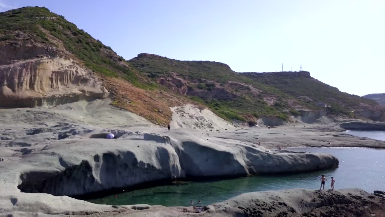 Drone Aerial shot of the natural swimming pool of Cane Malu in Sardinia, Italy. A wonderful typical mediterranean coastal landscape
