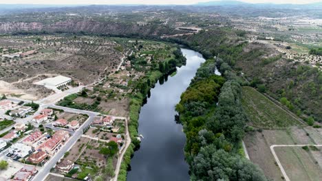 aerial view of a river running through a lush green valley