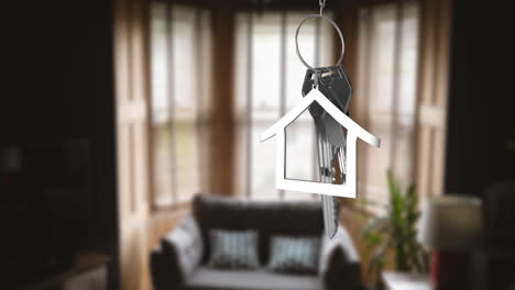 animation of silver key with house shape over empty room