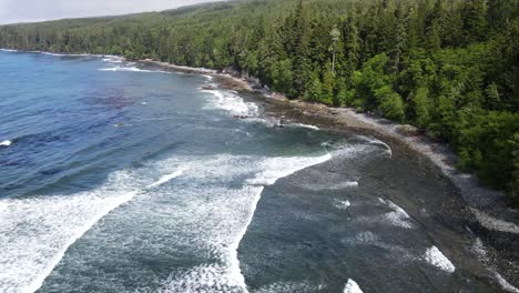 sombrio beach revealed by 4k drone on a cloudy summer day with almost no one around