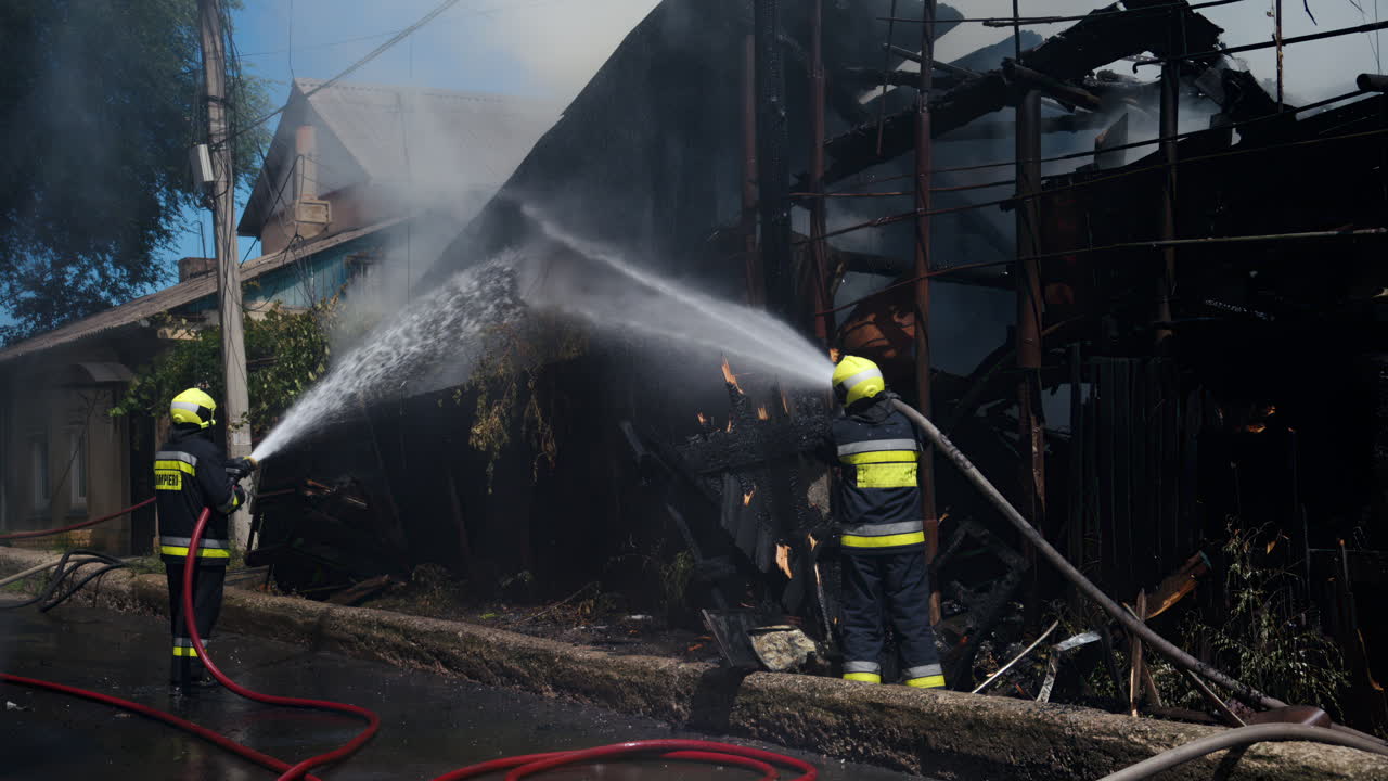 Firefighters trying to extinguish a house on fire