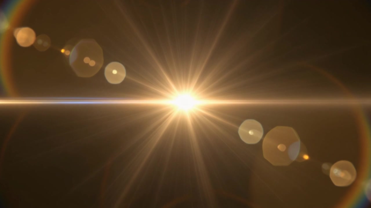 Luminoso effetto flare dorato su sfondo scuro