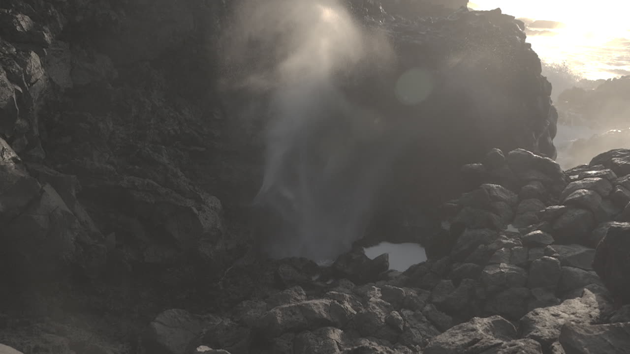 Powerful Ocean Waves Crashing Against Volcanic Rocks