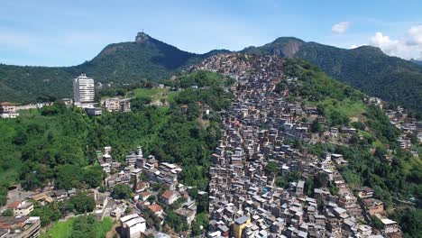 aerial view of a rio de janeiro hillside favela, christ the redeemer in distance