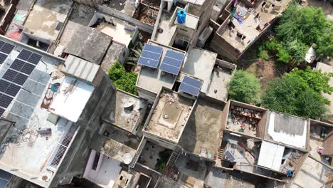 aerial birds eye view of solar panels on roof of building in badin, sindh in pakistan