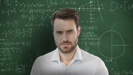 man in front of moving mathematical graphs and formulae on blackboard