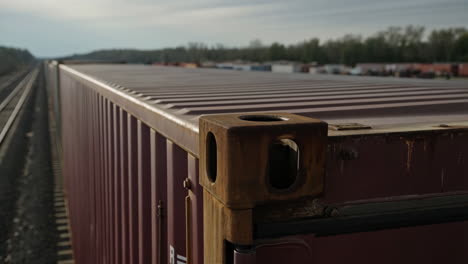 detail of a freight container on train tracks
