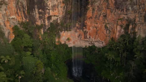 Purling-Brook-Falls-filmed-with-a-Drone-going-backward,-Australia