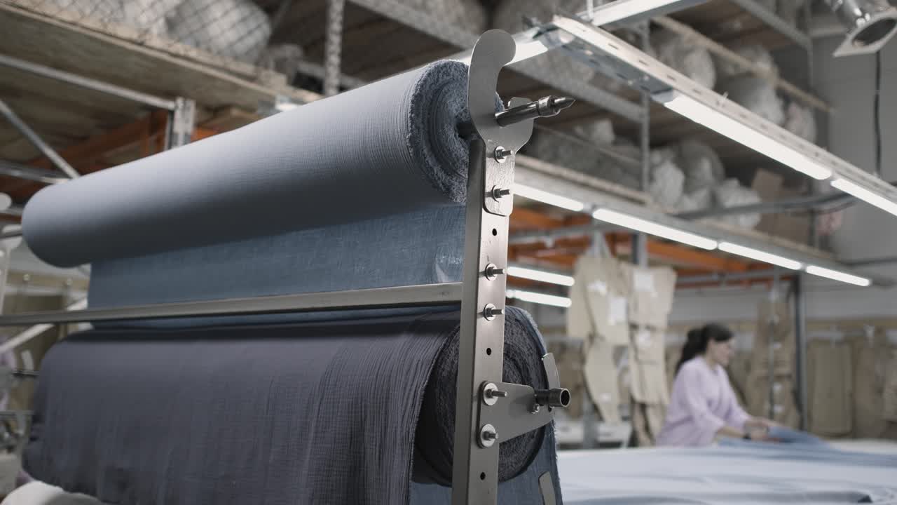Fabric rolls in a textile manufacturing facility Premium Stock Video ...