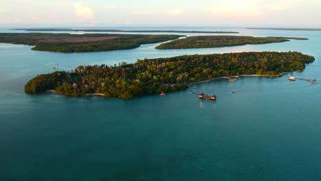 stunning aerial seascape with turquoise water and mangrove trees at sunrise at leebong island in belitung indonesia