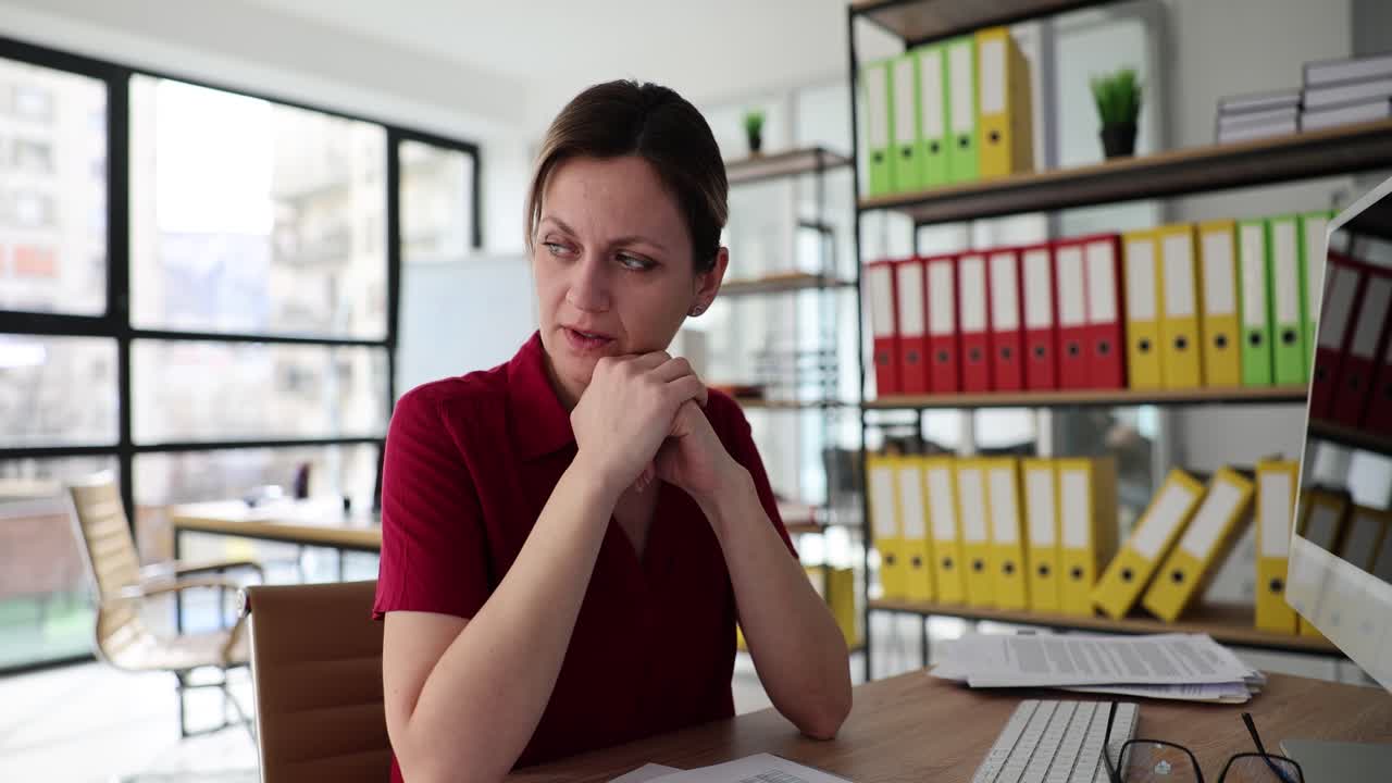 Woman sitting at desk in office