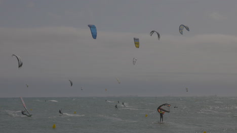 kitesurfers on a windy day at sea in barcelona