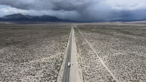 an rv driving west on highway through the