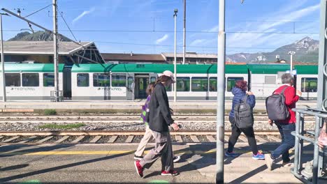 passengers boarding a train at milan station