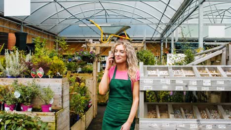 female florist talking on mobile phone