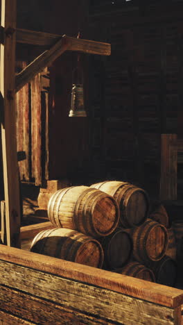 old wooden barrels in a rustic barn