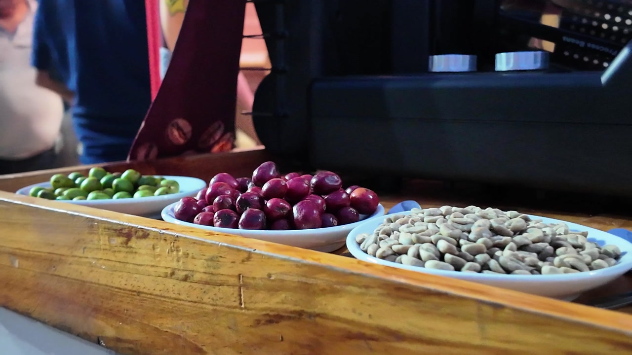 Various kinds of coffee beans displayed at an outdoor market stall
