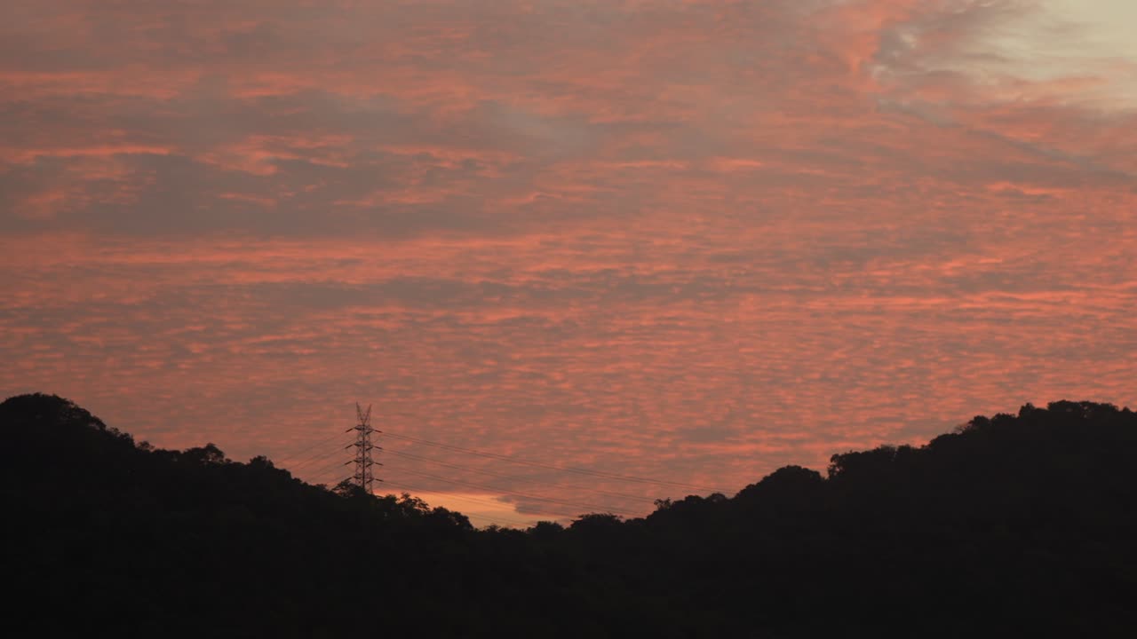 morning orange sky beautiful with mountains and electric tower