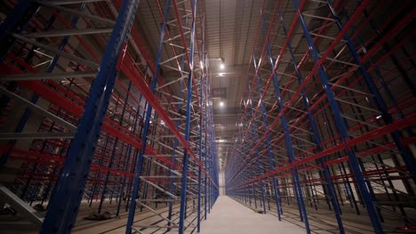 big and modern warehouse under construction, featuring metal shelving and other industrial equipment.