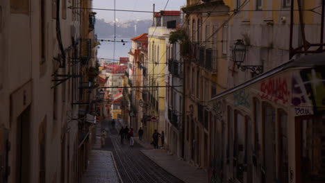 Antique-Cable-Car-On-The-Typical-Streets-In-Lisbon,-Portugal