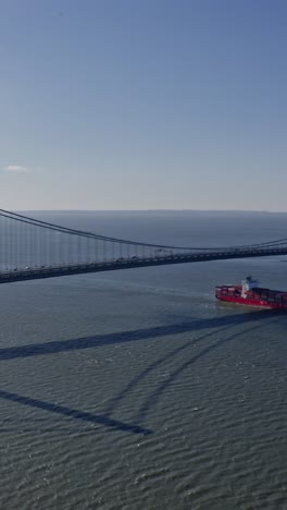 verrazano narrows bridge with passing cars and trucks