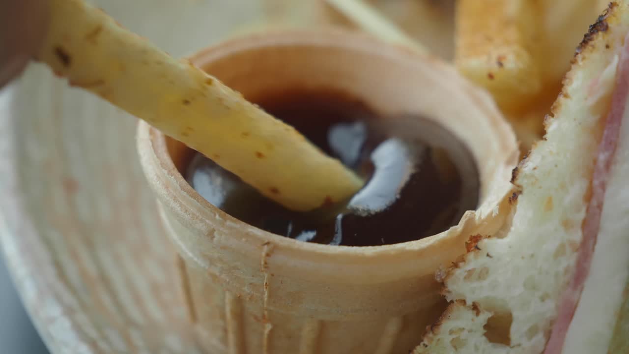 French fry dipped in sauce