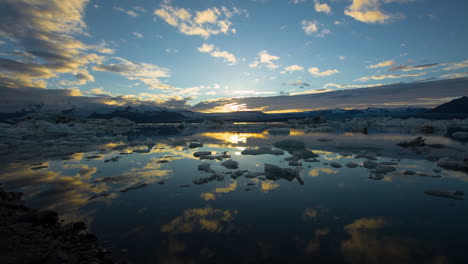 sunset over icelandic glacier lagoon