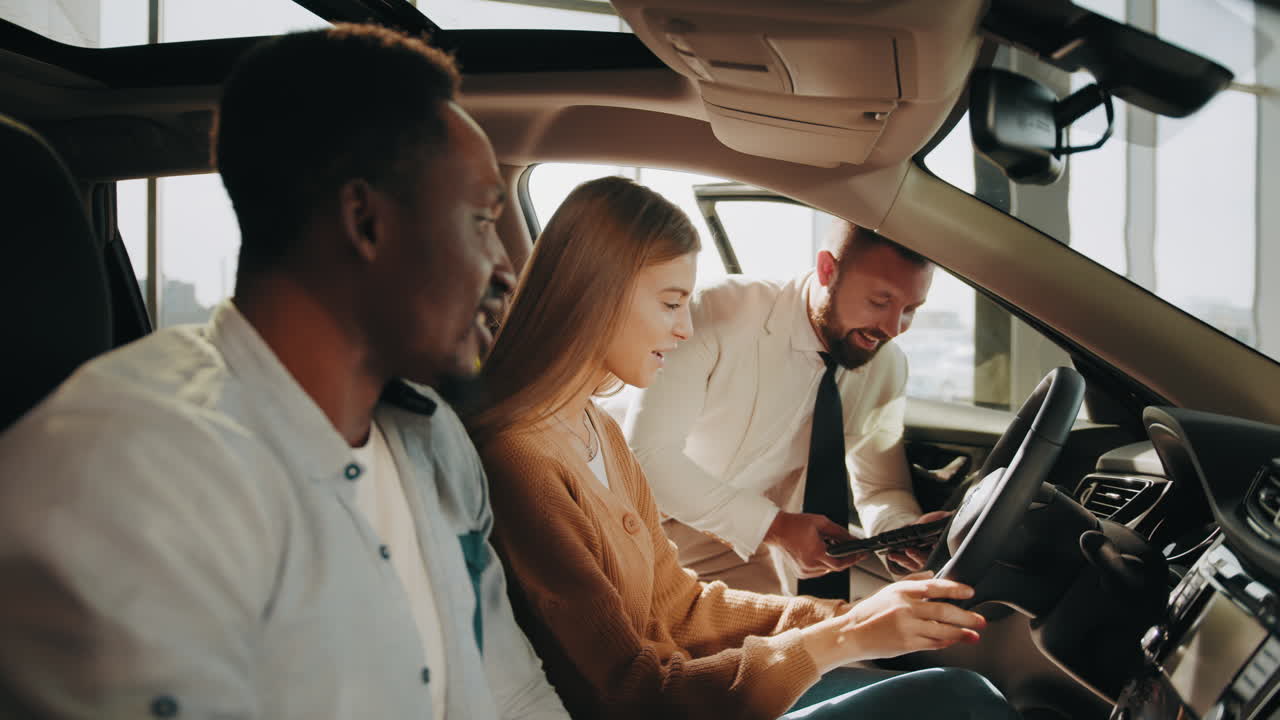 Couple Test Driving a Car at a Dealership