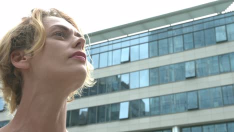 Business-woman-looking-around-business-center